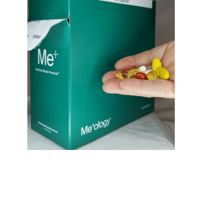 Person holding supplements in hand